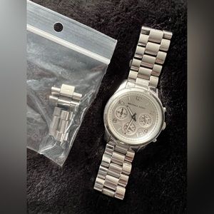 Women’s Michael Kors watch. With extra links to add back in for size. No box.